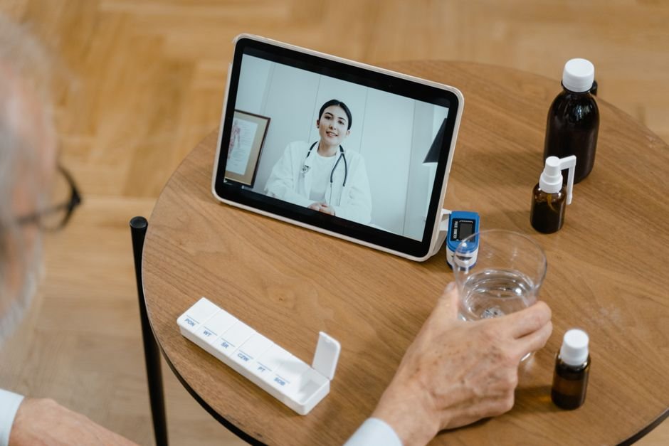 Senior using telehealth platforms for seniors on a tablet during a video visit